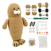 Hugging Seal Crochet Starter Kit contents showing finished sea animal plushie, chenille yarn, hook, and instructions