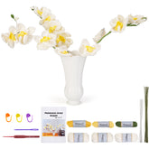 Complete DIY crochet kit for white orchid bouquet, including yarn, hook, floral wires, and pattern booklet