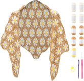 Complete DIY kit for floral daisy crochet shawl in beige and white, including yarn skeins and hook