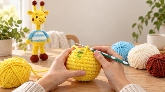A maker using a stitch marker to recover their place in a giraffe crochet kit project
