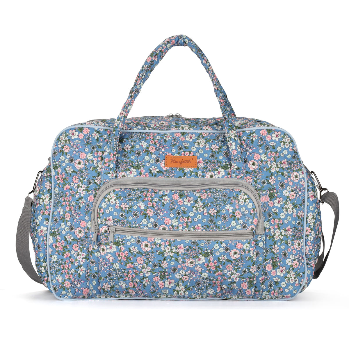 Large capacity bag for crochet in Christmas print holding colorful yarn beside crafting tools
