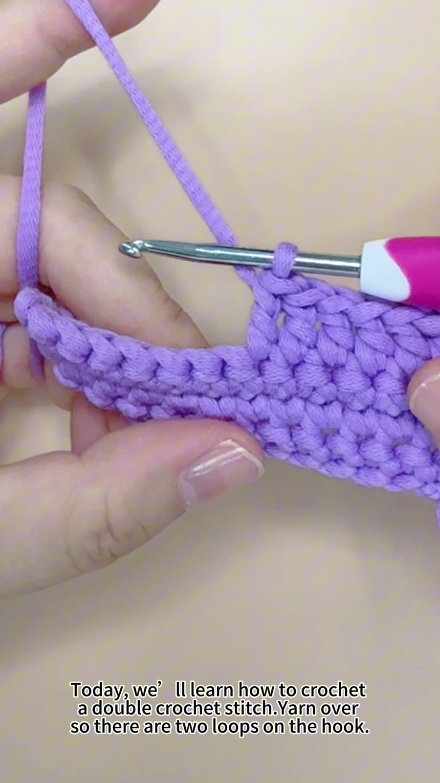 Close-up demonstration of a double crochet stitch